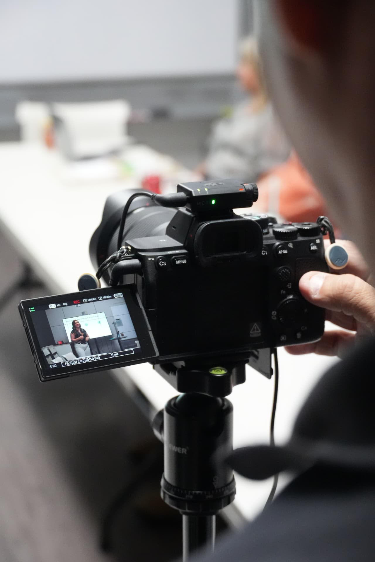 Professional video camera recording a business presentation